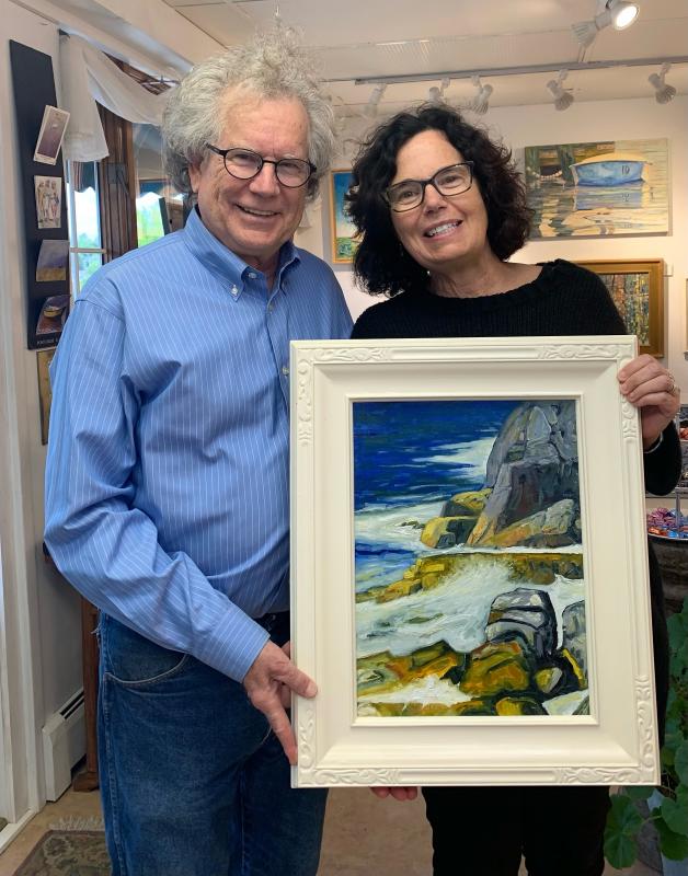 John Seitzer and the new owner of one of his landscape paintings on First Friday. Lynne Seitzer photo