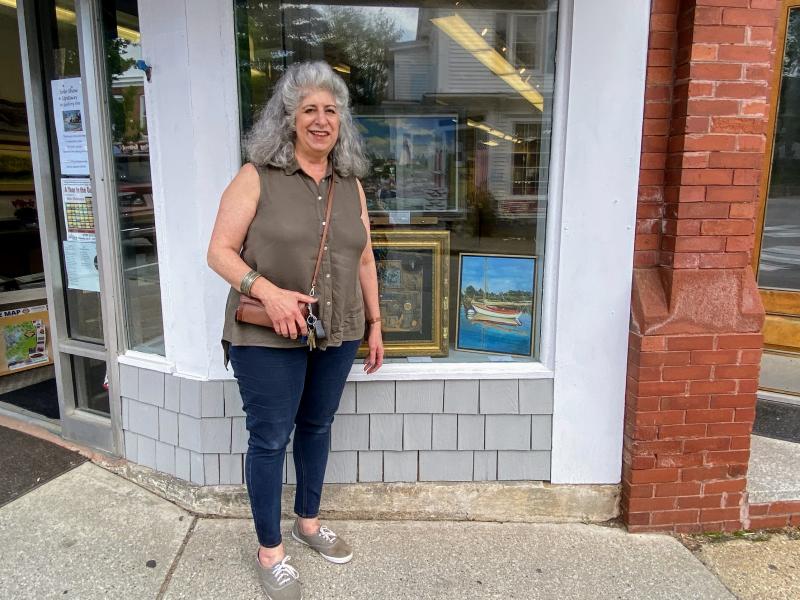 Marylou Lazos stands next to her piece on display at Boothbay Region Art Foundation. ISABELLE CURTIS/Boothbay Register