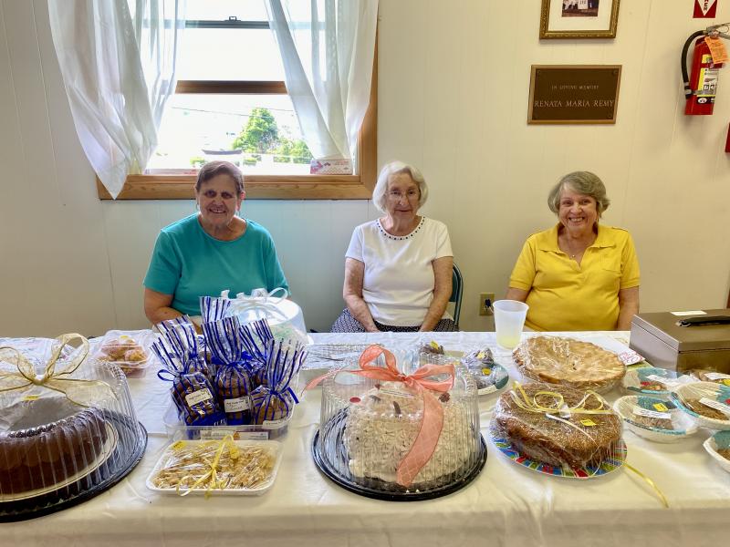 Mary Pierce, left, mans the bake sale with other volunteers. ISABELLE CURTIS/Boothbay Register
