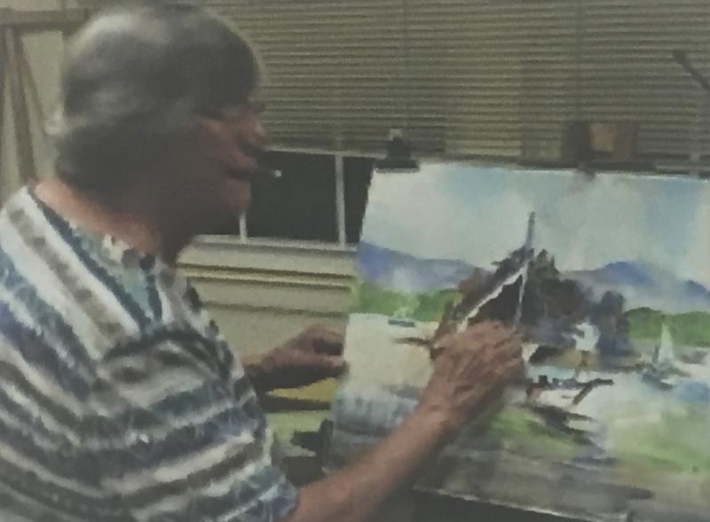 Carol Jessen doing what she loved best: painting and teaching. Courtesy of Marcia Annenberg