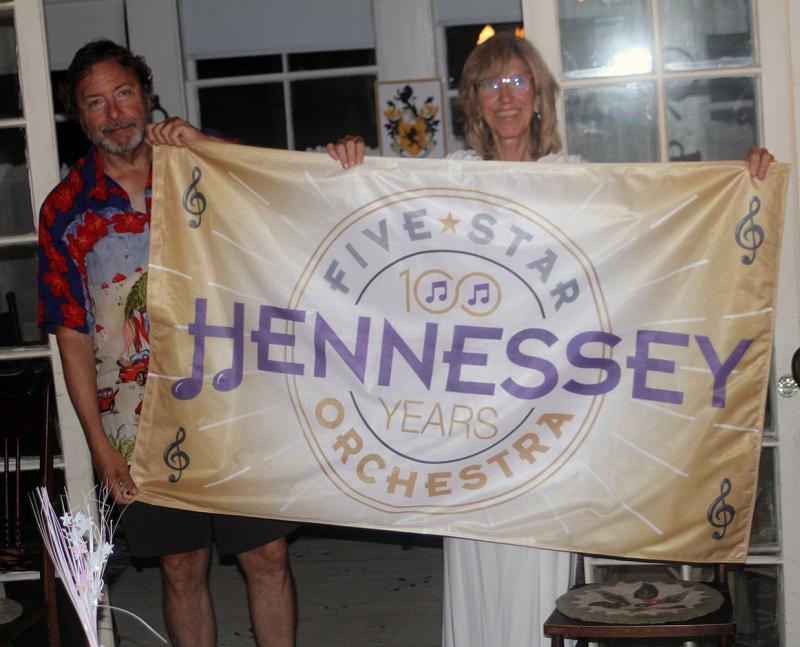 John and Carol Wells hold up the centennial banner. STEVE EDWARDS/Boothbay Register