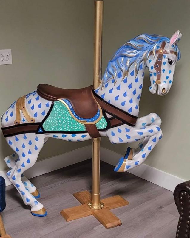 This blue spotted white horse was painted by Olivia May Partner. Check it out at Divine Health & Beauty in the Meadow Mall. Courtesy of Burke’s Island Farm