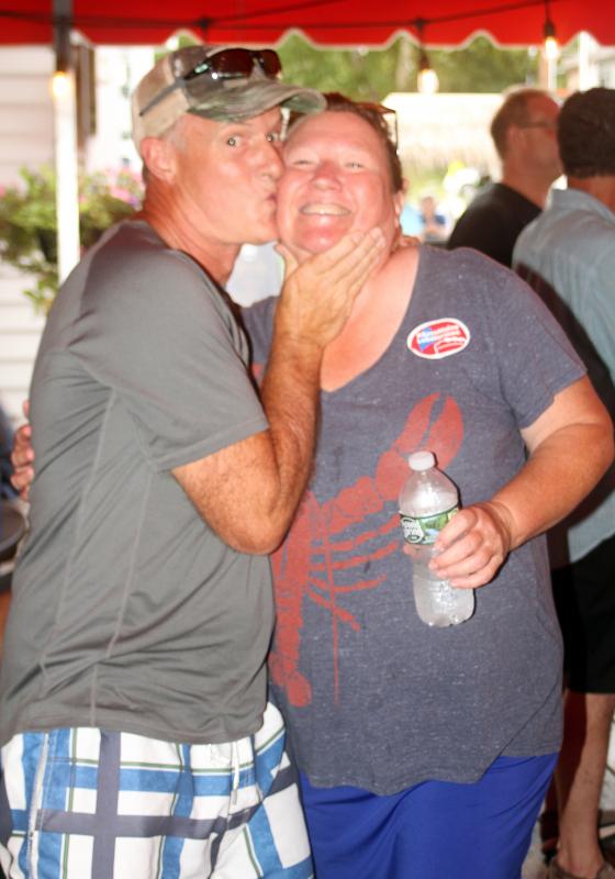 Brady’s owner Jennie Mitchell gets kissed. STEVE EDWARDS/Boothbay Register