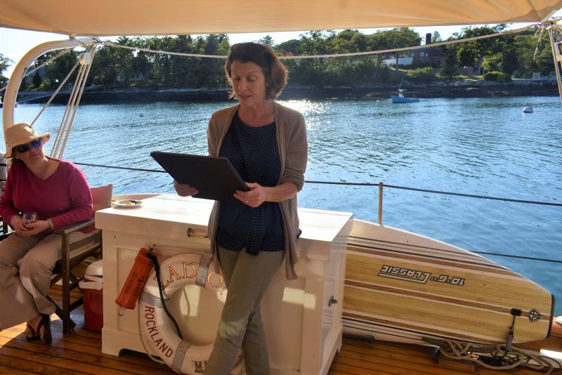 Jane Barnes, co-owner of schooner Ladona, reads the proclamation from Gov. Janet Mills during the vessel’s centennial celebration Sept. 8 at Hodgdon Marina. LISA KRISTOFF/Boothbay Register