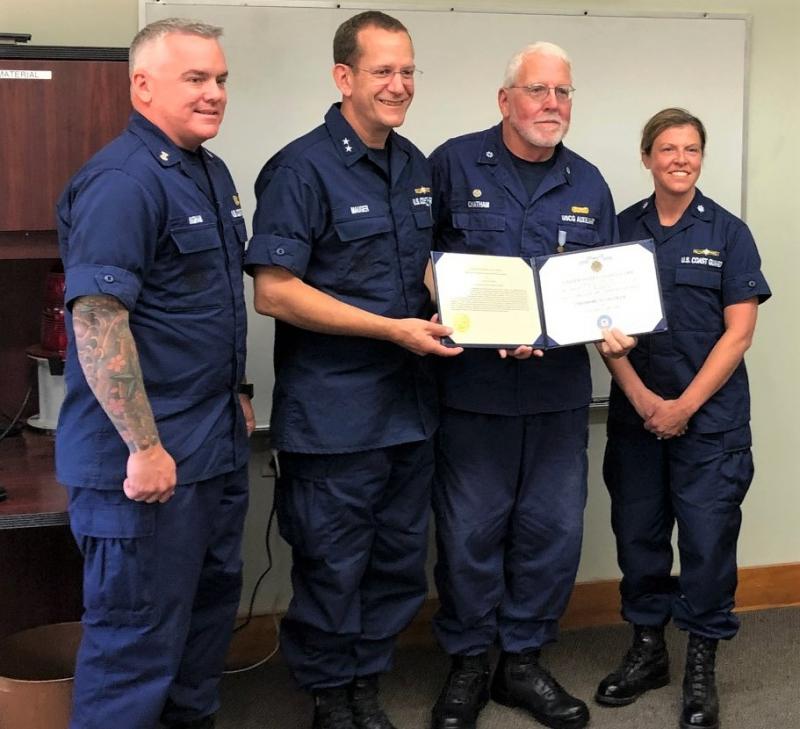 Pictured from left are: CMCPO Michael D. Ingham, Command Master Chief, First Coast Guard District; RADM John W.Mauger, Commander, First Coast Guard District; Auxiliarist Ted Chatham; and CDR Megan Drewniak, Head of Prevention, Coast Guard Sector Northern New England. CG Auxiliary photo by Wayne Stanley