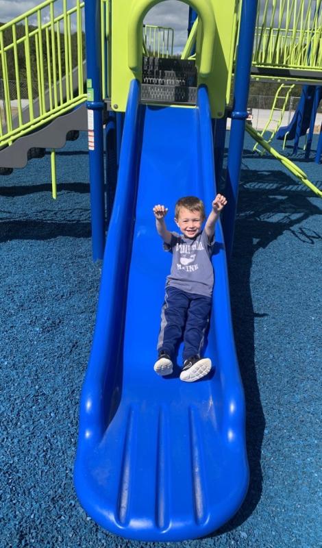 Pre-kindergartener Angus Kaler enjoys the slide Sept. 14 at the new Clifford Park Playground. BILL PEARSON/Boothbay Register