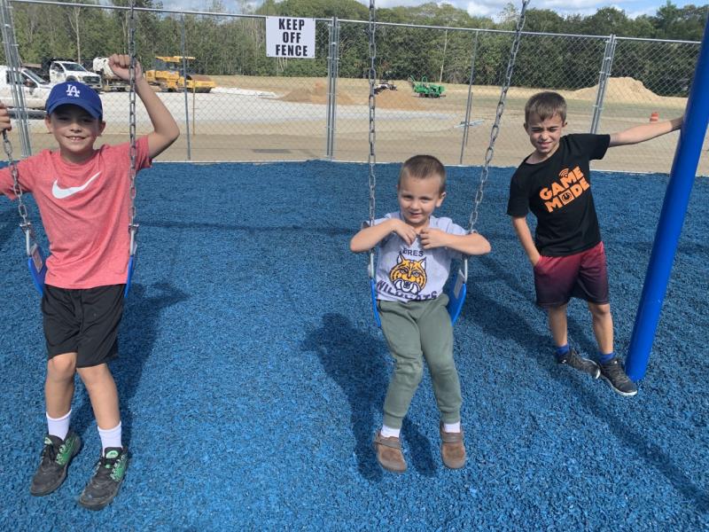 A new playground is providing “swinging” times at Clifford Park. Pictured, from left, are Maddox Hutchison, Caleb McHugh and Iliya Sanborn. BILL PEARSON/Boothbay Register