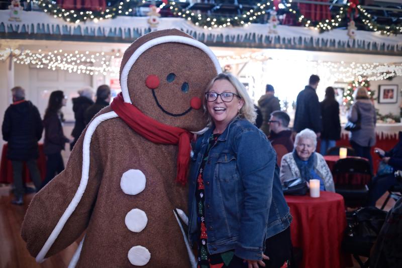 Ginger and Rep. Holly Stover share a holiday hug during the 2022 Gingerbread Spectacular. Robert Mitchell photo