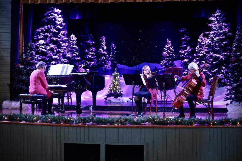 Genie O’Connell, Emily Barker and Kerry Jackson played on the final day of the Gingerbread Spectacular, Sunday, Dec. 18. Robert Mitchell photo