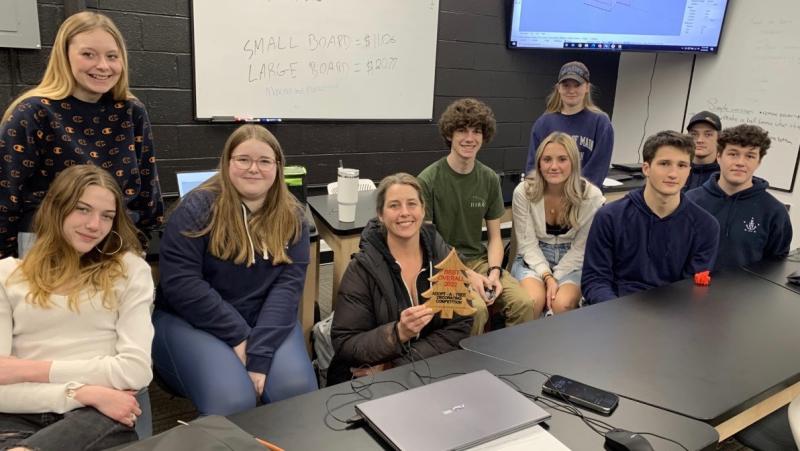 Ae Ceramics won Best Overall Award in Boothbay Harbor Region Chamber of Commerce’s Adopt-A-Tree fundraiser. On Jan. 11, owner Alison Evans received the award from a Boothbay Region High School STEM class. BILL PEARSON/Boothbay Register