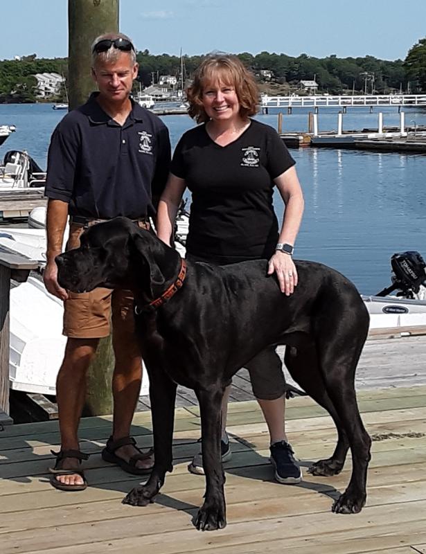 Blake’s Boatyard owners Dusty and Amy Goodwin with Tonka. JANE CARPENTER/Boothbay Register
