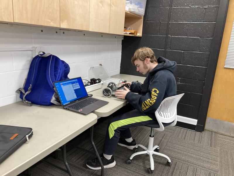 Gabe Barter works on his robot in programming class. Courtesy of Emily Higgins