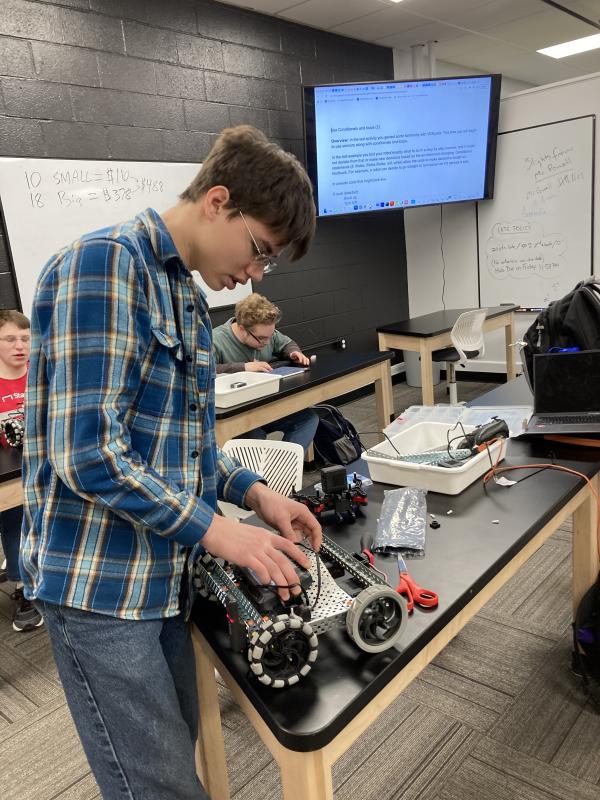 Rodi Mayne builds a robot. Courtesy of Emily Higgins