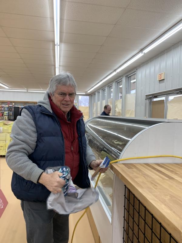 March 17, local carpenter Jeff Pendleton helps Sweetz & More get ready to open April 1. SUSAN JOHNS/Wiscasset Newspaper