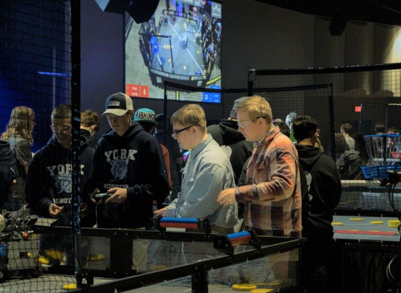 Kolton Campbell drives the robot while Afton Warren-Burdin makes suggestions during one of Saturday’s matches. Sebastian Warren-Burdin photo