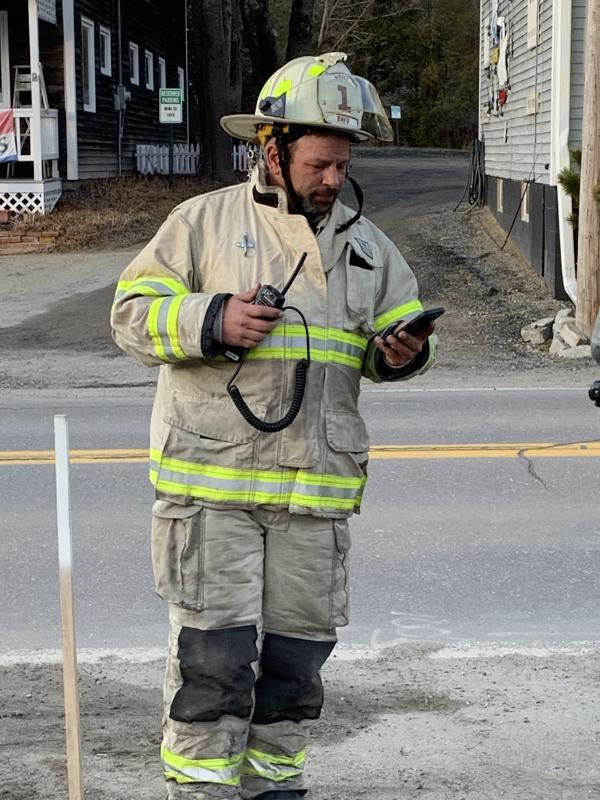 Boothbay Harbor Fire Chief Nick Upham makes the call to Lincoln County Communications to start the training session. KEVIN BURNHAM/Boothbay Register