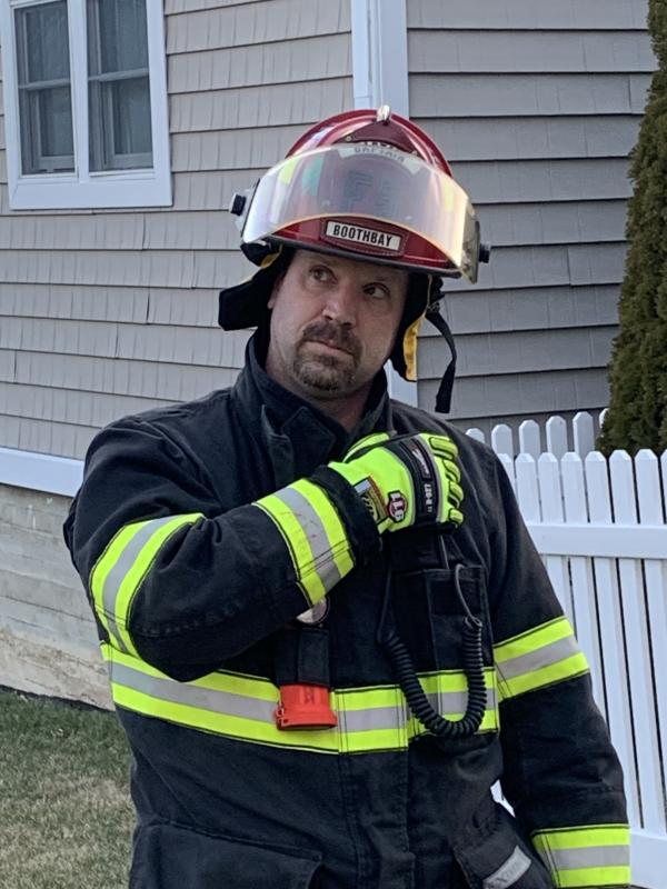 Boothbay Captain Tim Pinkham observes the younger firefighters’ work. KEVIN BURNHAM/Boothbay Register