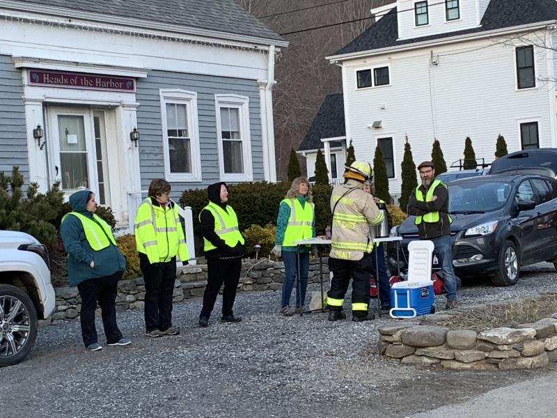 Members of Boothbay Region Fire Auxiliary offer refreshments across the road from the training. KEVIN BURNHAM/Boothbay Register
