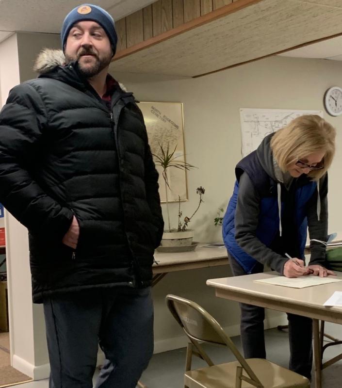 Michael Maxim of Edgecomb waits as Barbara Brennan signs his nomination papers for selectman. Maxim is not running in the April 15 special election. He is running for a full term during the May municipal election. Maxim attended the March 7 select board meeting and budget hearing. BILL PEARSON/Boothbay Register
