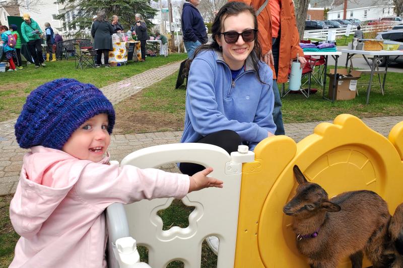 Farrah Crommet, 2, makes a four-legged friend from Saffron & Honey Homestead during BHML’s annual Earth Day Fest on April 22. FRITZ FREUDENBERGER/Boothbay Register
