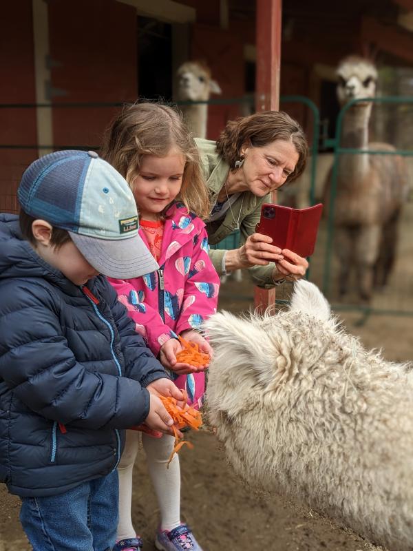 Students feed Theodora shredded carrots. CANDI JONETH/Boothbay Register