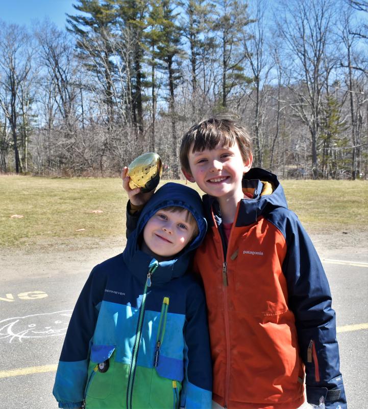 The Williams brothers, Mason, left, and giant gold egg finder, Liam, of East Boothbay. LISA KRISTOFF/Boothbay Register