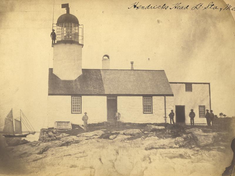 Built on a seawall at the water’s edge, this is the oldest known photograph of Hendricks Head’s 1829 lighthouse and keeper’s dwelling. Courtesy of National Archives