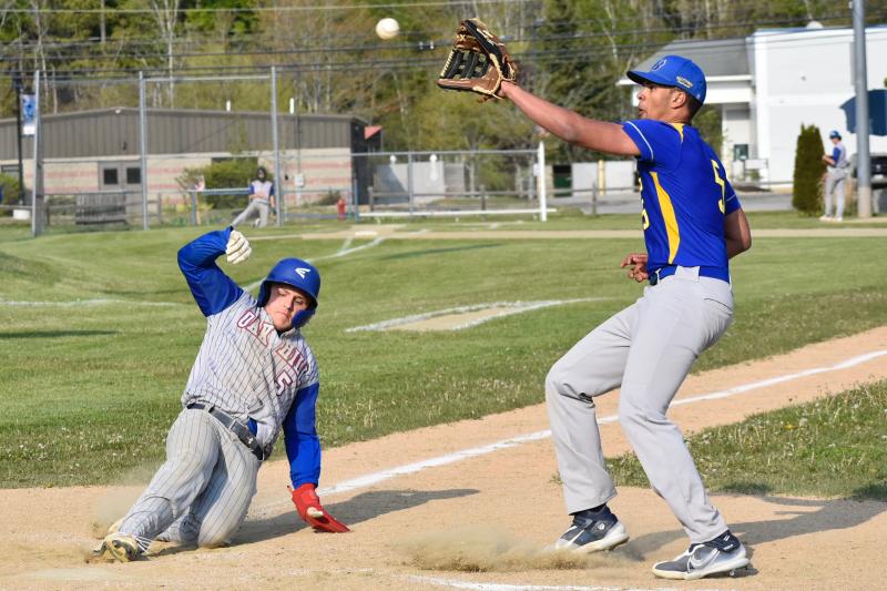 BRHS’ Luke Morley rushes for the ball at home plate against Oak Hill May 19. FRITZ FREUDENBERGER/Boothbay Register