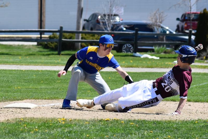 Seahawk Aidric Canada taps out a Monmouth player in Saturday’s game. FRITZ FREUDENBERGER/Boothbay Register