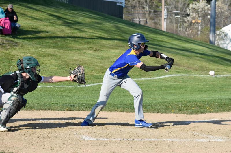 Seahawk Aidric Canada makes a safety squeeze bunt in the eventual winning play against Carrabec. FRITZ FREUDENBERGER/Boothbay Register