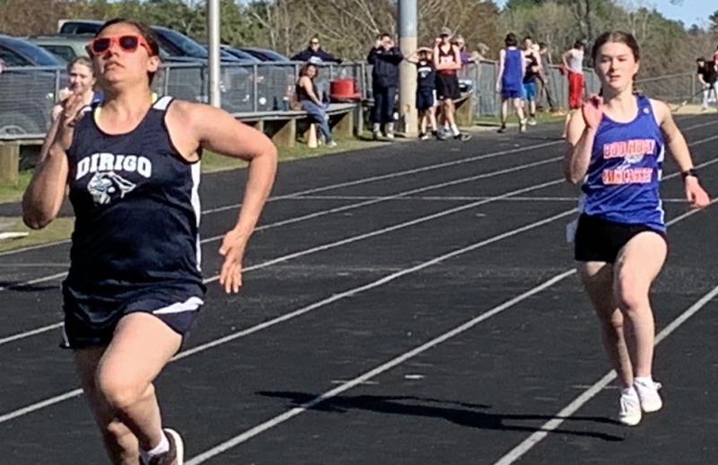 Boothbay/Wiscasset runner Makaya Hodson, right, makes her move in a Mountain Valley Conference race May 9 in Wiscasset. BILL PEARSON/Boothbay Register
