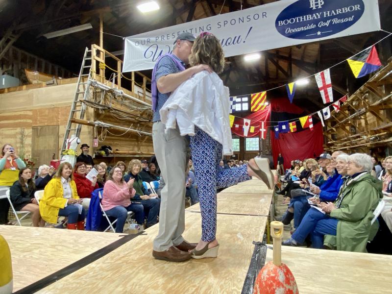 Julie and Paul Roberts from the House of Logan share a kiss on the runway. ISABELLE CURTIS/Boothbay Register