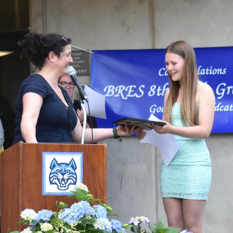 Assistant Principal Julianne Hansbury presents the Secretary of State Eighth Grade Citizenship Award to Sophia Mansfield during the BRES Eighth Grade Recognition Night June 20. FRITZ FREUDENBERGER/Boothbay Register