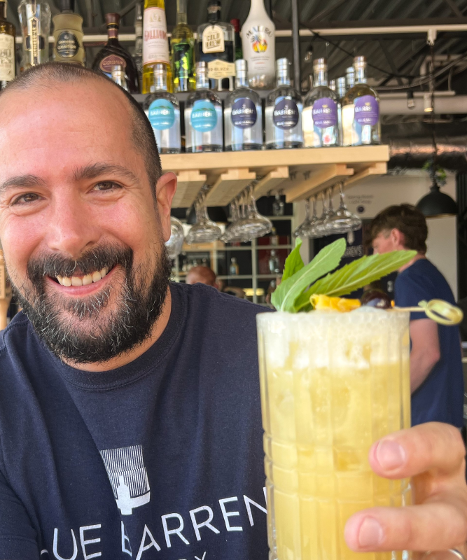 Andrew Stewart of Blue Barren in Camden with the "Into the Light!” Ease My Pain cocktail. Customers ordering this pineapple, coconut, mint, and rum drink in July are funding shelter, car, legal and food expenses for Maine’s domestic abuse survivors. Photo by - Patrisha McLean