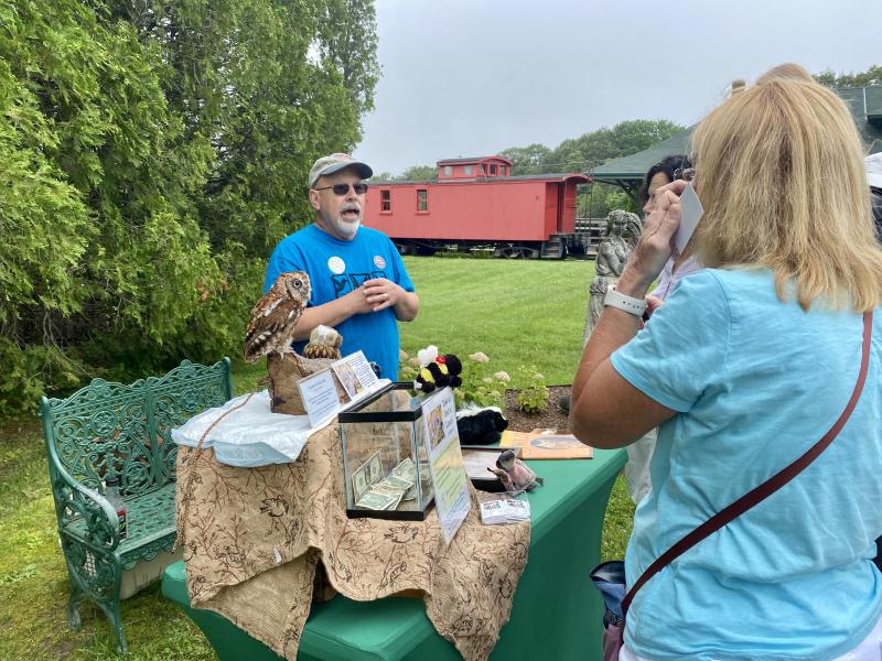 Dan Weekes and Williow the owl of Pollination Station greet visitors. ISABELLE CURTIS/Boothbay Register