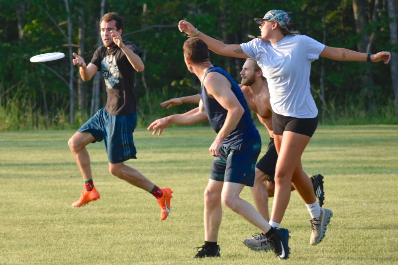Players hustle for the flying disk during the July 13 Ultimate Frisbee game at Clifford Park in Boothbay. FRITZ FREUDENBERGER/Boothbay Register