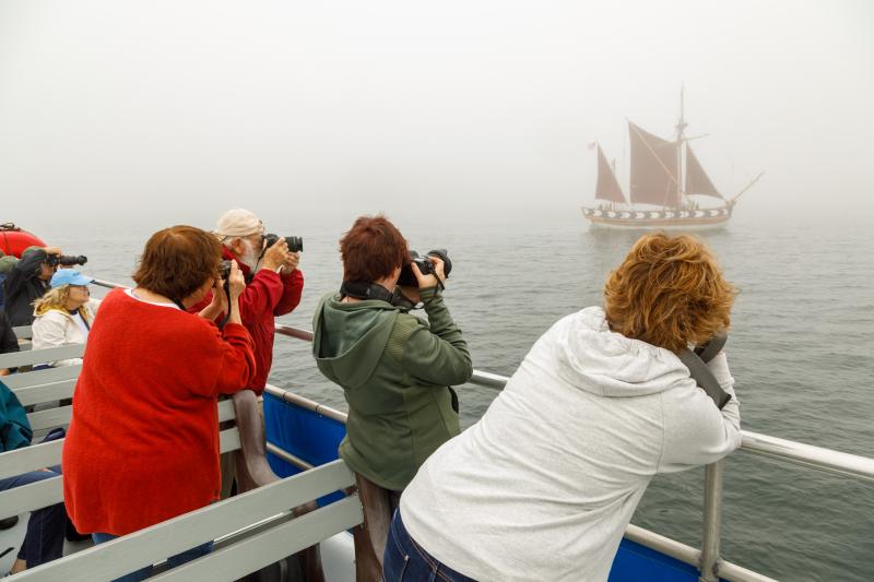 Photographers on the Windjammer Days Photography Cruise focus their lenses on the Virginia. Michael Leonard photo