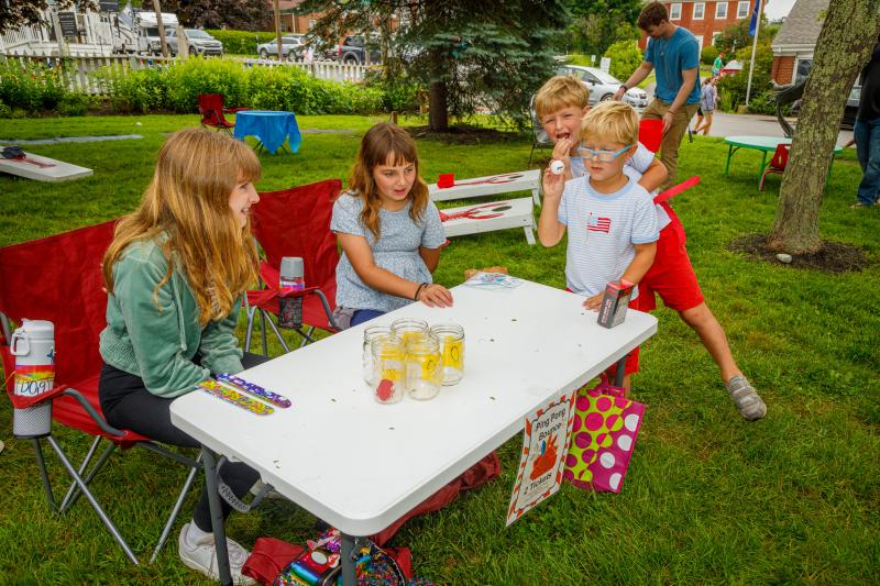 From left, Jessie Ullo, Kayla Watts and Grant Lovelace play a game at BHML’s fundraising carnival. Michael Leonard photo