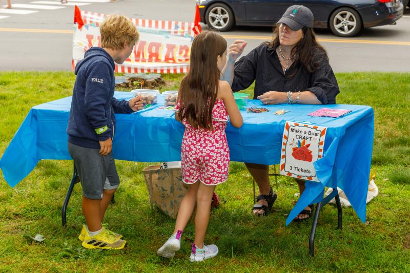 Medea Harris runs a craft table. Michael Leonard photo