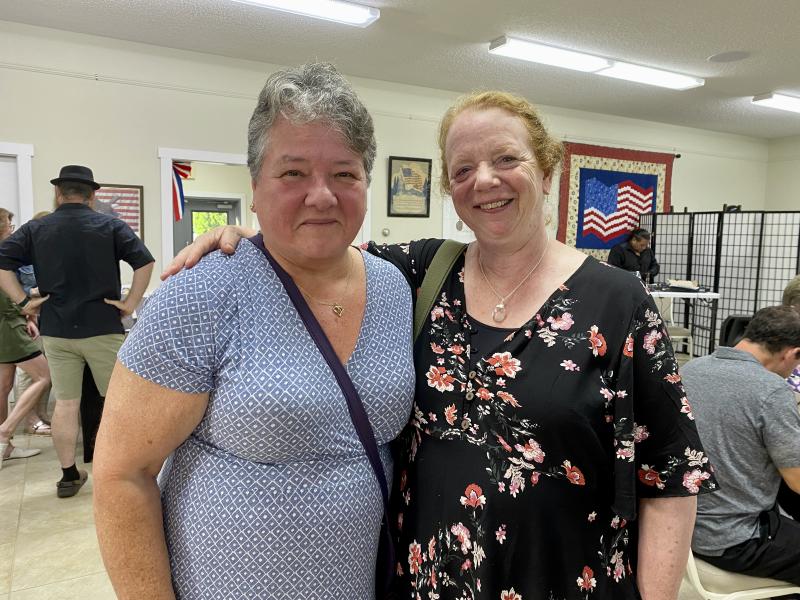 Mickey Gerhard, a volunteer for Midcoast Humane, and Suzy Cavalieri enjoy the festivities. ISABELLE CURTIS/Boothbay Register