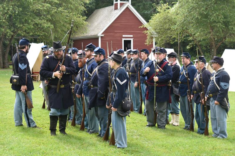 Captain Matt Bray inspects his troops’ firearms. FRITZ FREUDENBERGER/Boothbay Register