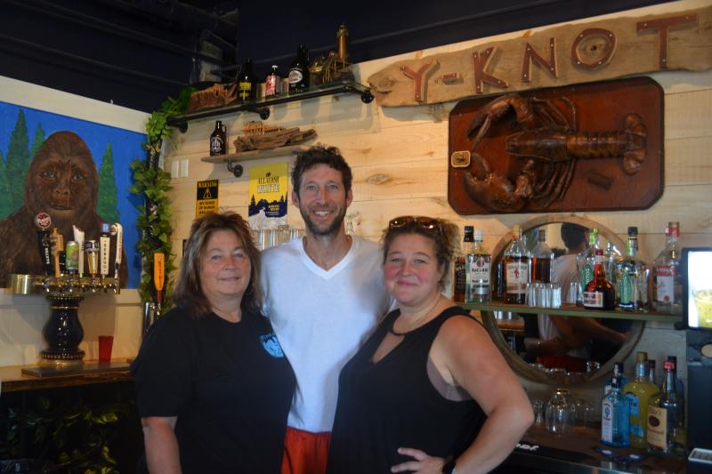 From left: Carol Heaberlin, Nick Heaberlin, and Mindy Jones stand behind the bar at their new restaurant, Y-Knot on the Water Gourmet Eatery, at 85 Parking Lot Lane in downtown Damariscotta. The location was previously the home of Maine Booch and Van Lloyd’s Bistro. Johnathan Riley photo