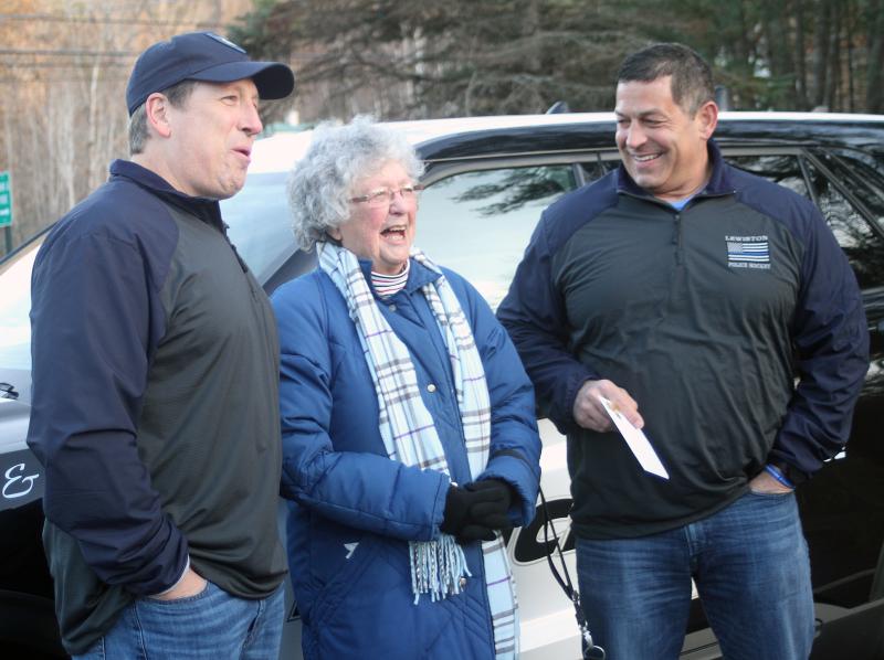 Mary Wallace presents Dunkin cards to LPD. STEVE EDWARDS/Boothbay Register