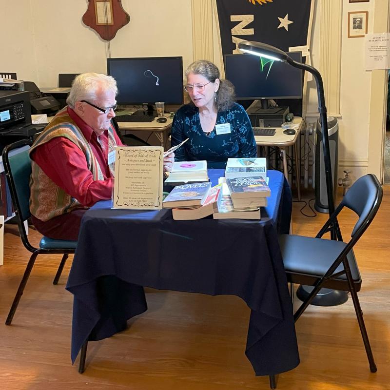 Richard Plunkett looks over an item for appraisal at the Historical Society museum. FRITZ FREUDENBERGER/Boothbay Register