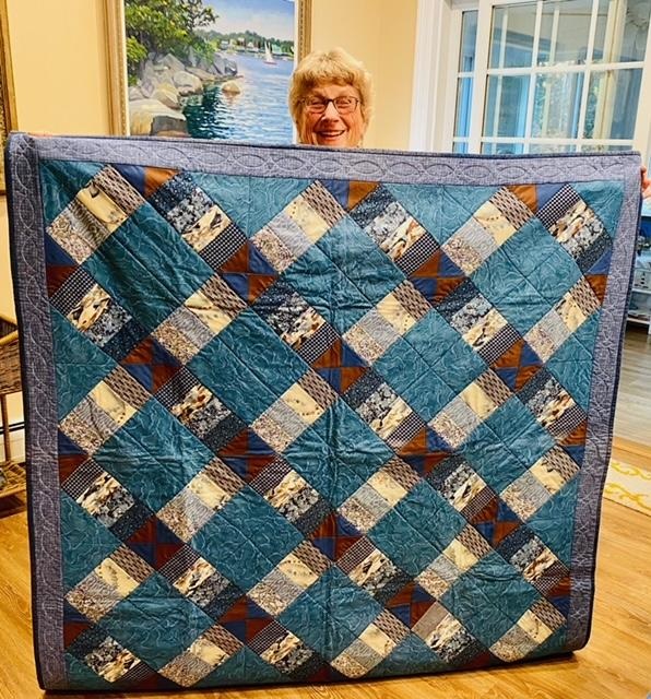 Sewing Group member, Carol Atwood Lyon donates her quilt to the project. Courtesy photo