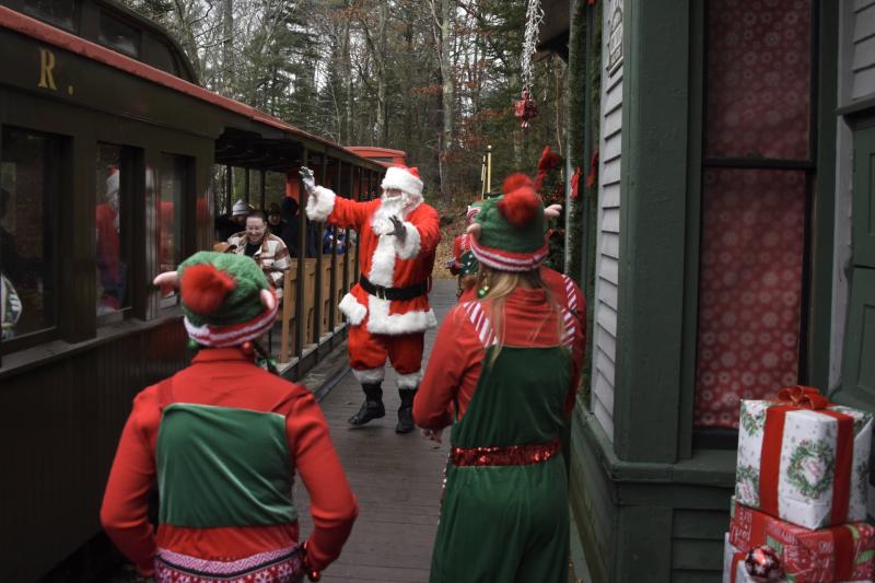 Santa and the elves greet the train. Bob Crink photo