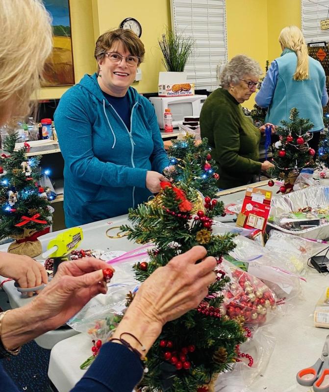 Melanie Groneng and the mini-tree crafters. Courtesy photo
