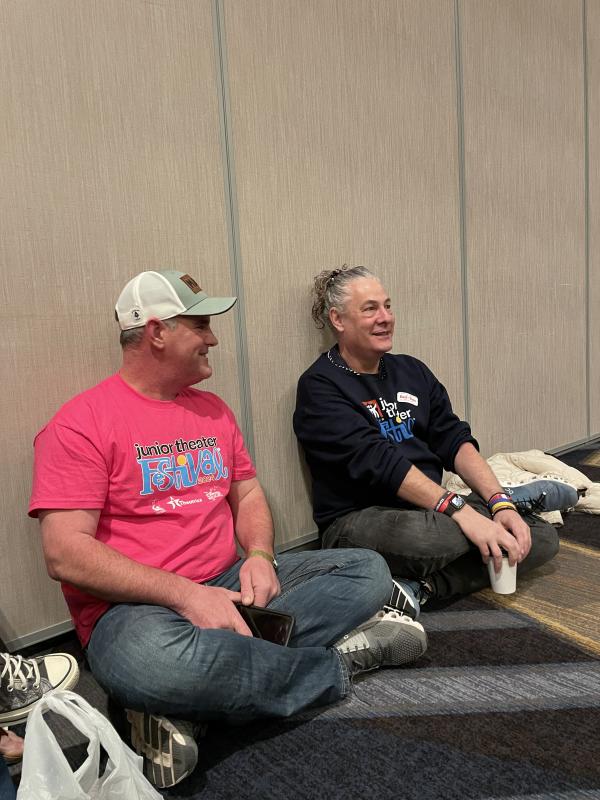 Corey Pottle sits with Tim McDonald during the Y arts adjudication piece. The team was overjoyed to have Tim in the audience. Courtesy photo