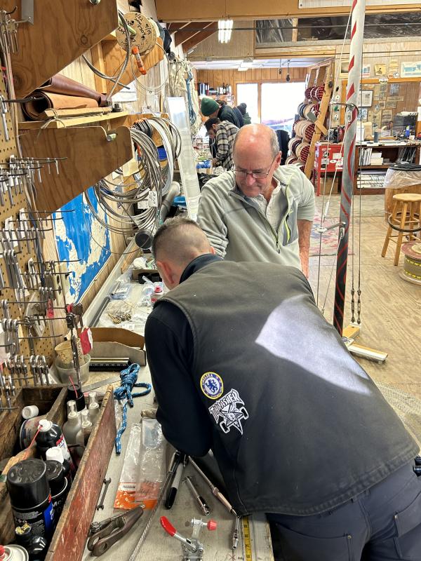 Jay Maloney watches as a student puts newly learned swaging techniques into use. JENNY BENNETT/Boothbay Register