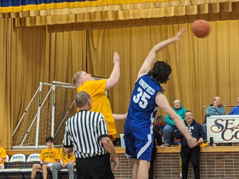 Seahawk Eddie Carpenter and Shipbuilder Sam Lambert tip-off Unified Basketball’s opening game. CANDI JONETH/Boothbay Register